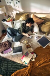“College student organizing schedule and studying while balancing academics and lifestyle responsibilities”